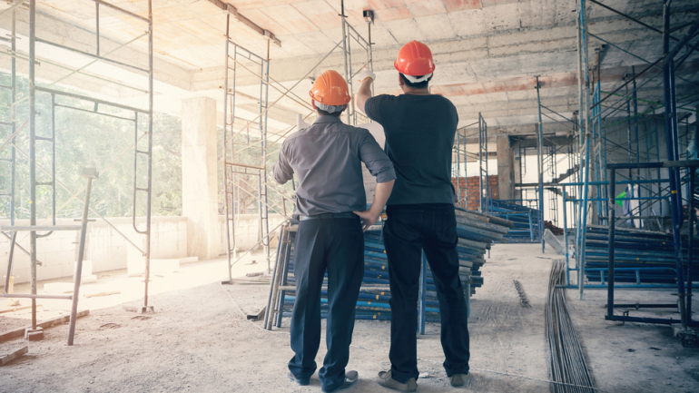 Construction workers in building project